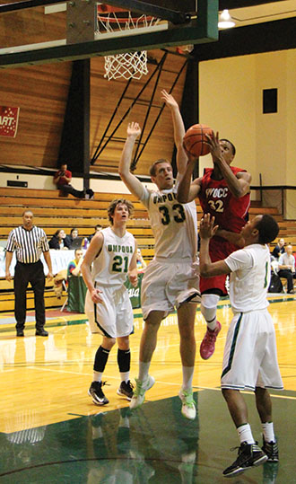 Jonathan Bolston (1) stops a Laker player as Zach Ginter (33) looks to block the shot.