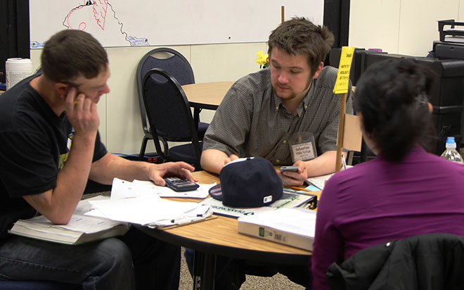 Math tutor Sebastion helps students before a test.